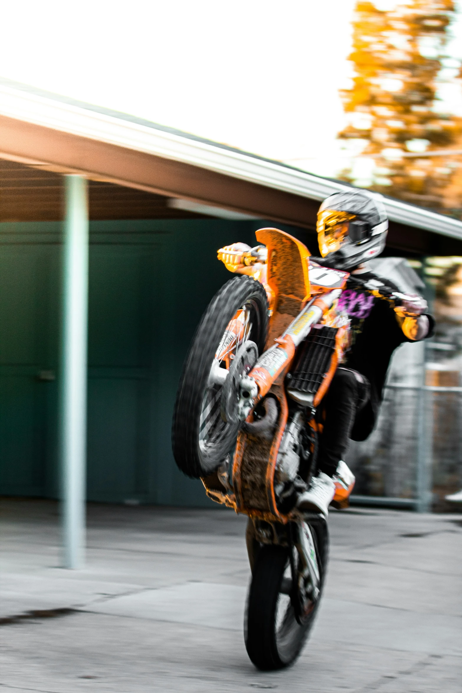 a man on a motorcycle performing a trick