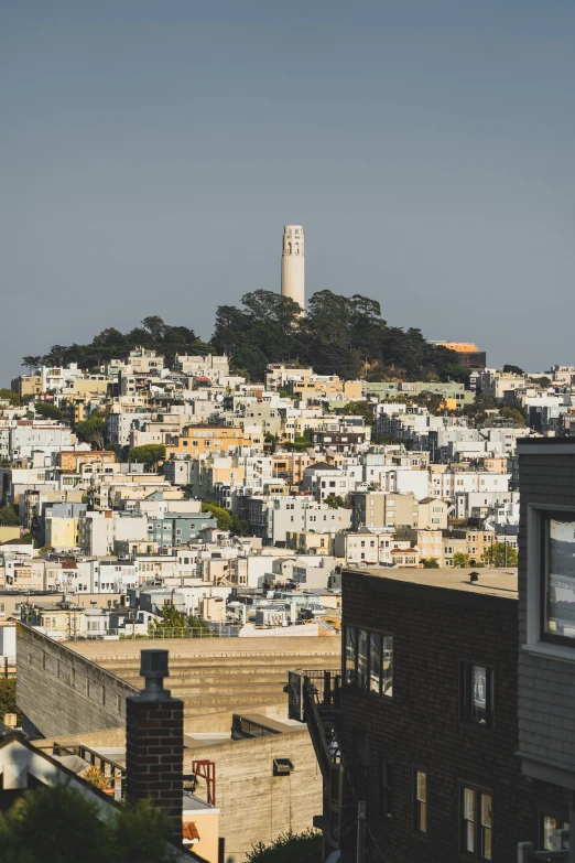 the white buildings line the hillside in the city