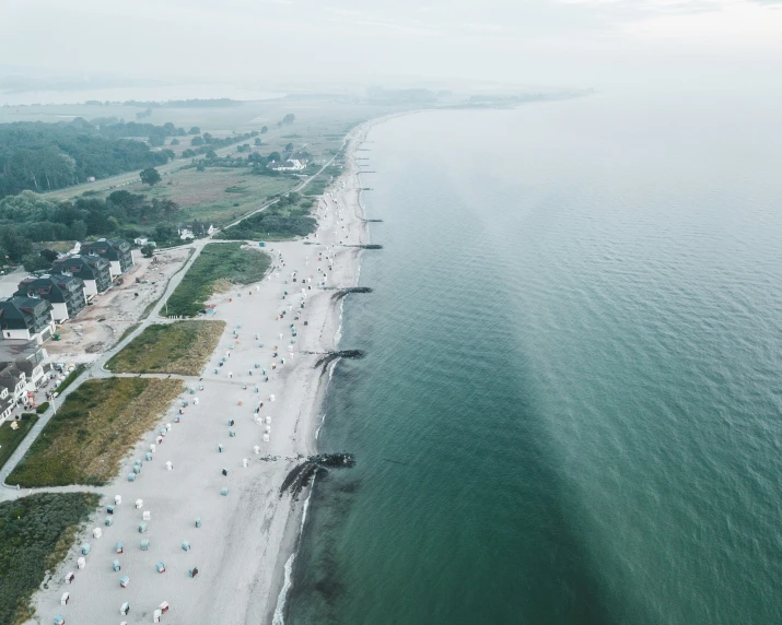 an aerial s of a sandy beach and ocean