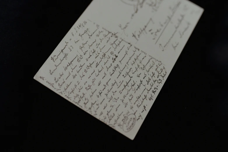 an old paper note with cursive writing on it