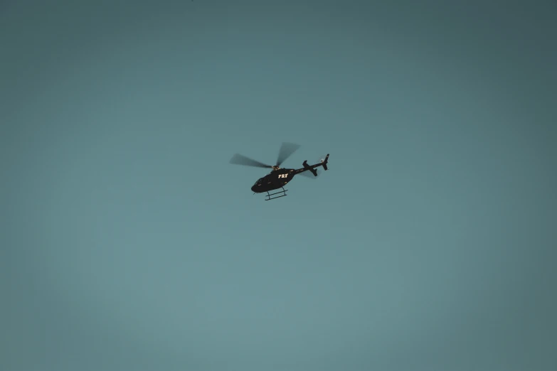 a helicopter that is flying in the sky
