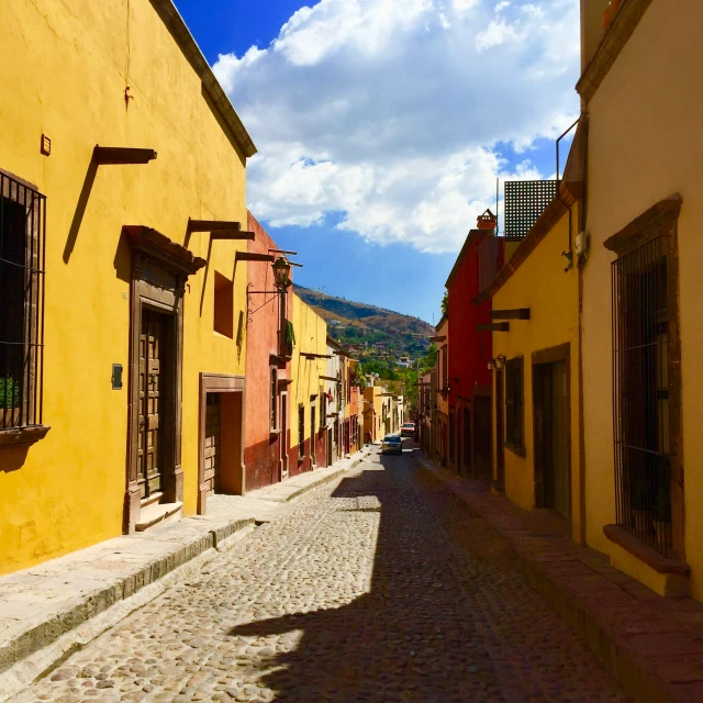 an image of an empty street with buildings on either side