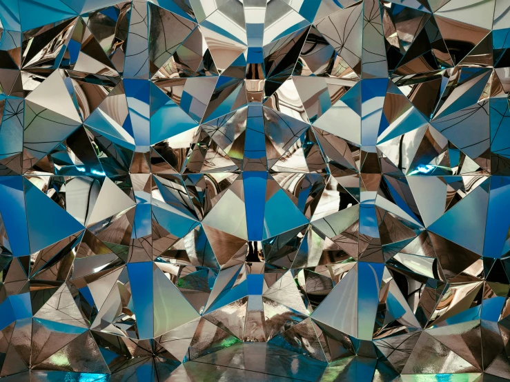 the image of a blue mirrored tile wall