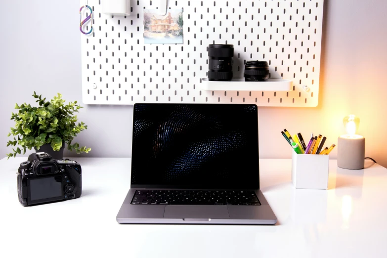 an open laptop sitting on a white desk