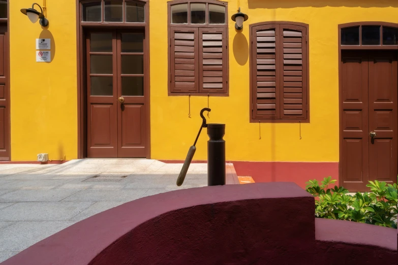 a yellow building that is sitting next to other buildings