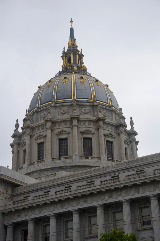 a large old building with a gold trimmed dome