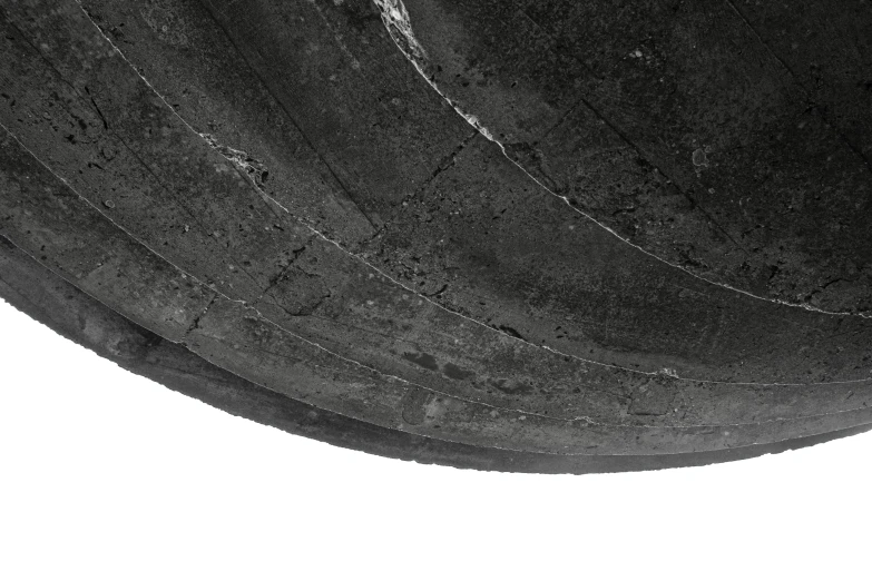 the underside of a motorcycle tire pographed in front of a white background