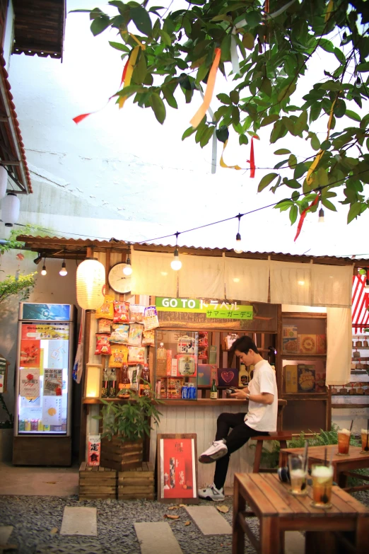 two people dancing in front of a convenience store