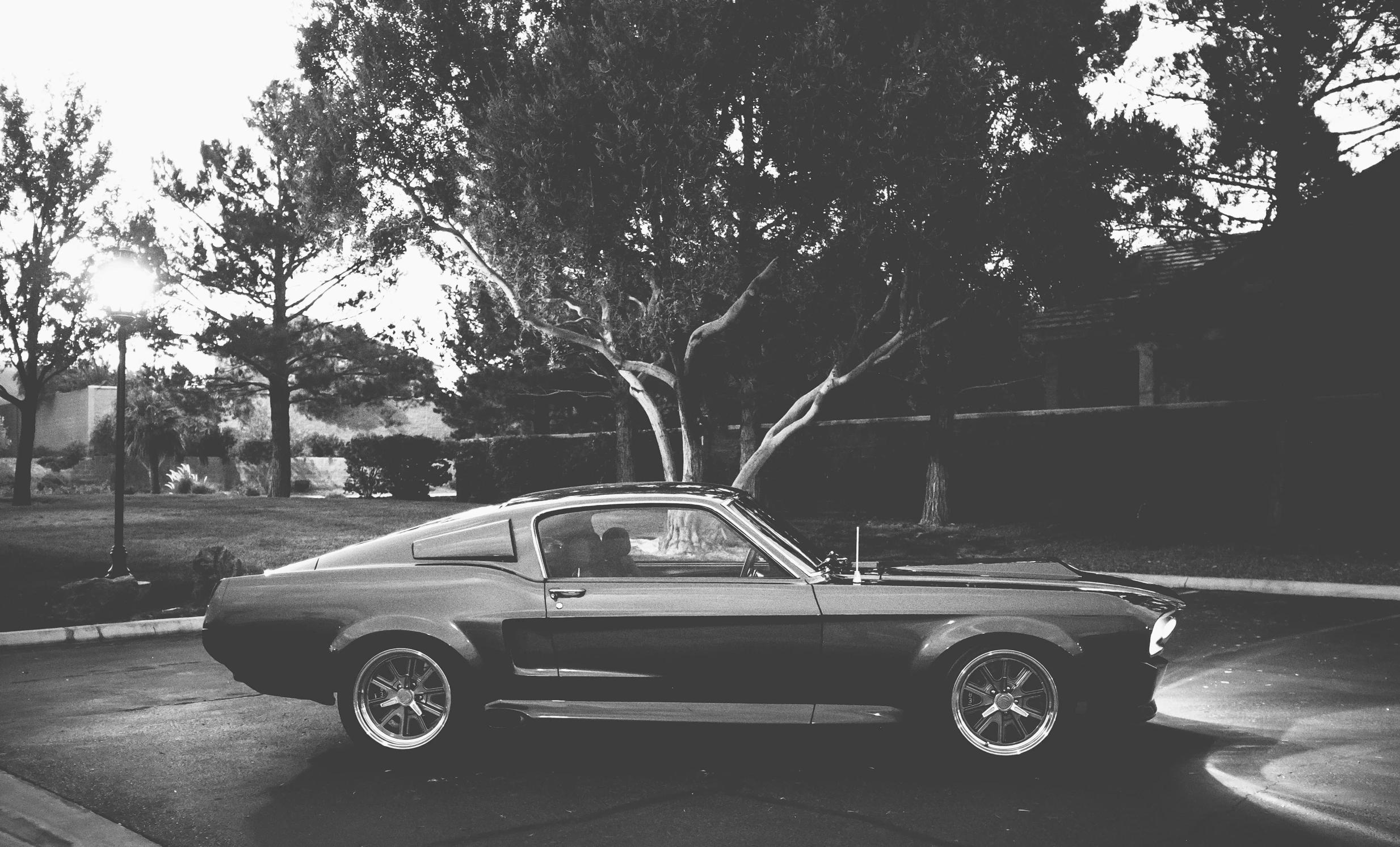 an old mustang is shown in black and white