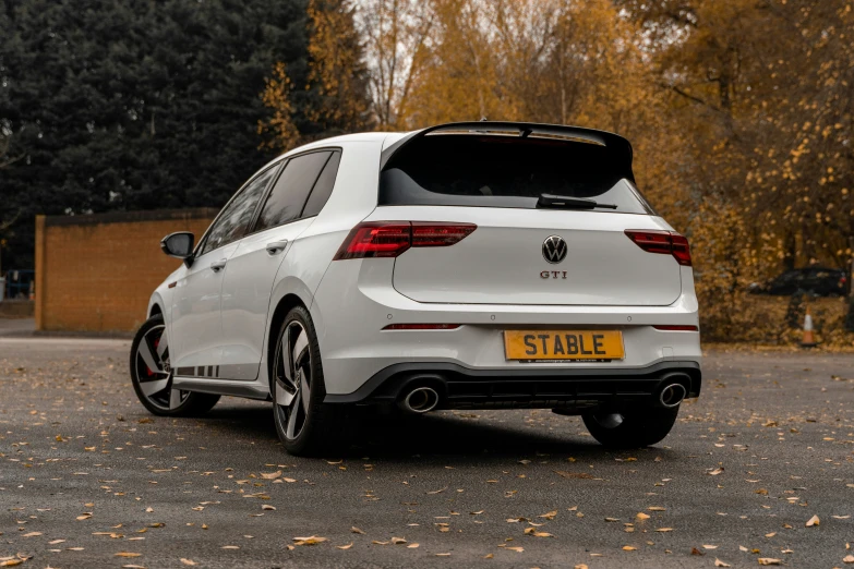 the rear end of a white volkswagen golf estate