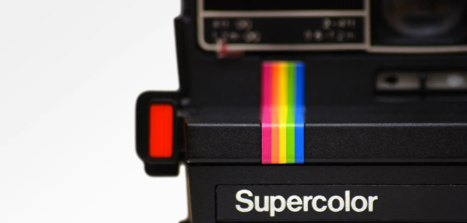 an old camera with the word supercolor painted on it