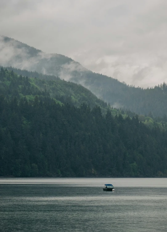 the boat is traveling through the large lake