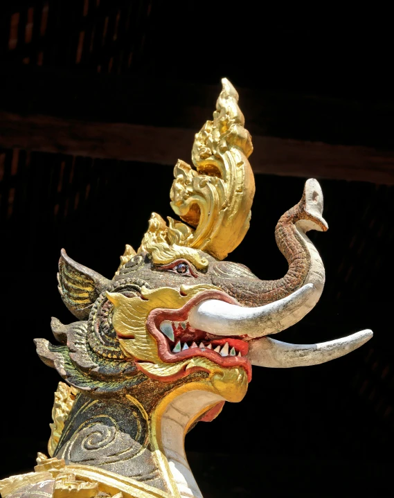 an intricate dragon and bird are positioned together