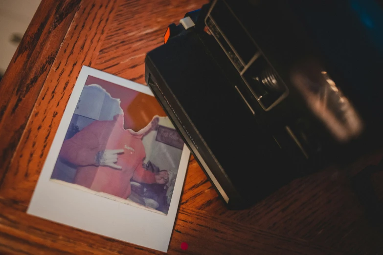 a picture of a woman on a table with a book next to it