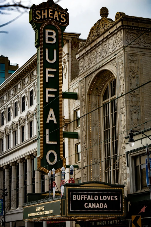 the burbato theatre building has many signage on it