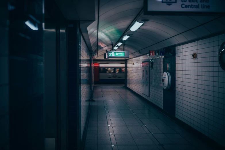 a subway station with a sign saying stop to exit