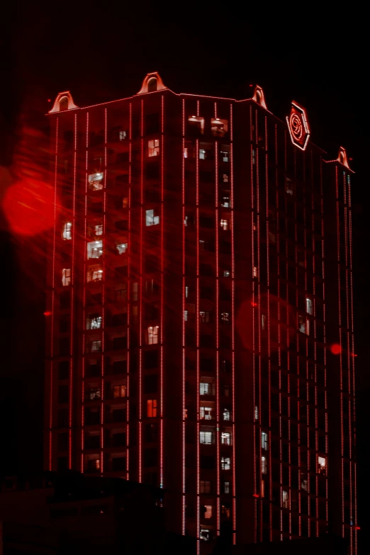 a red lighted building lit up in the dark