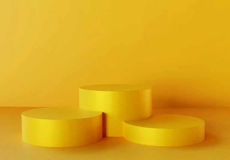 three circular yellow objects are on a yellow background