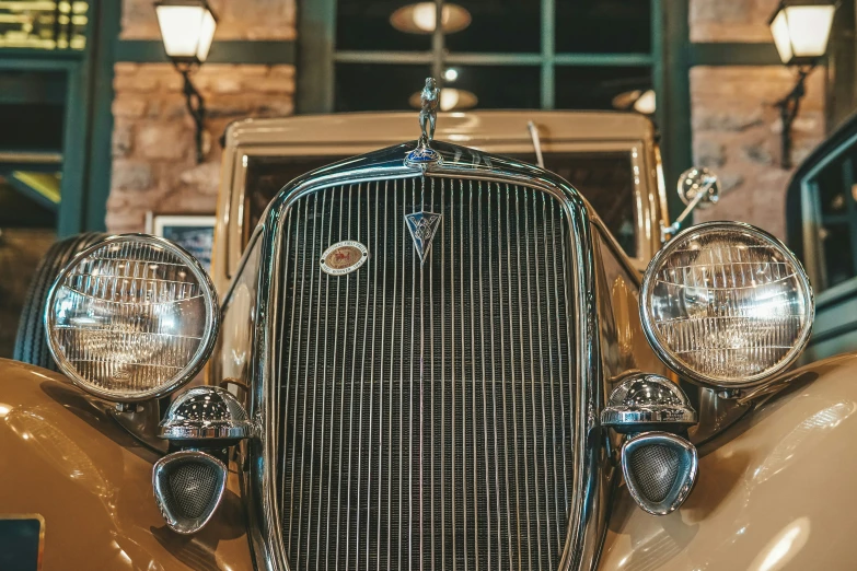 an old fashioned car in front of a building