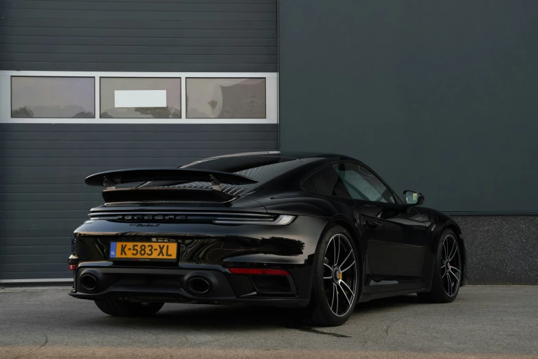 the back end of a black sports car