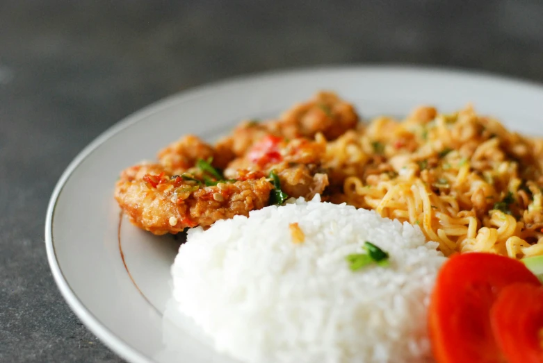 plated food with white rice, tomato and shrimp