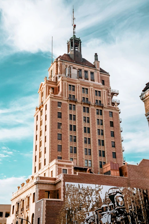 a tall brick building with a clock tower