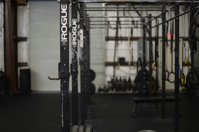 a gym room with lots of black objects