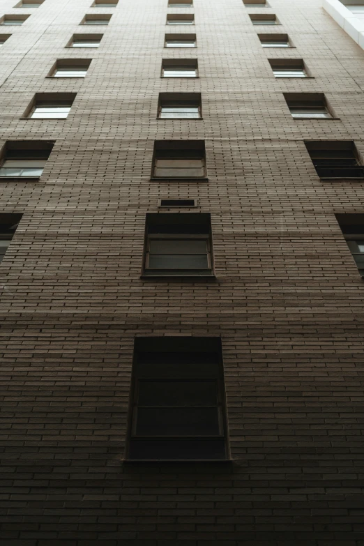 a very tall brick building with several windows