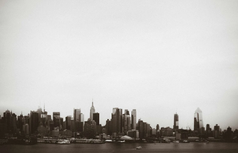 the city skyline looks almost black and white