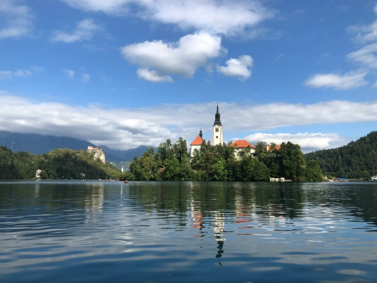 church in the middle of a small island surrounded by water