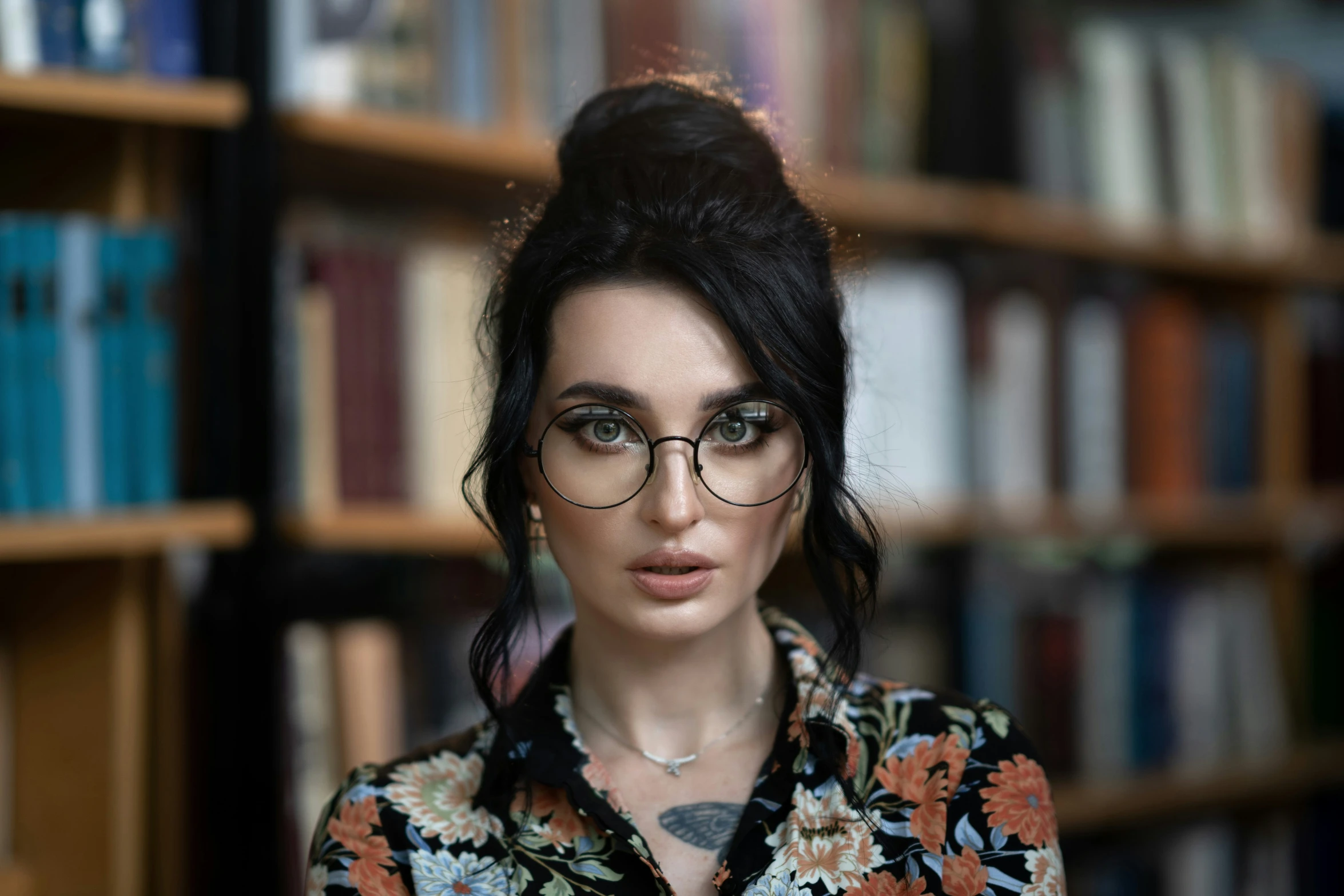 an image of a woman in front of bookshelves