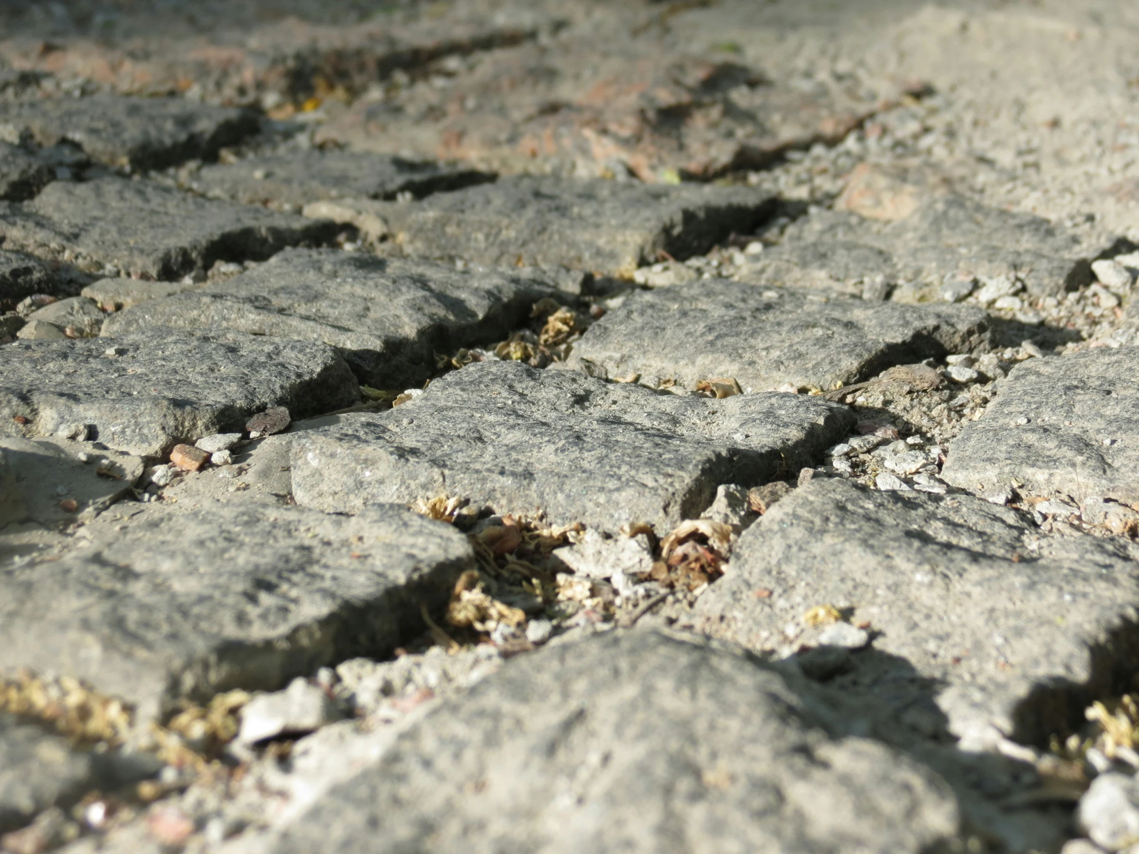 the stone surface has small squares of s and pebbles