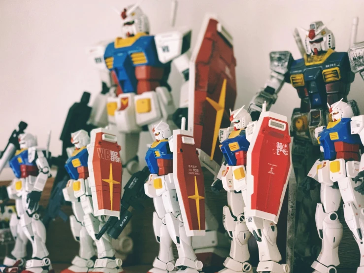 many plastic robots are lined up in a row