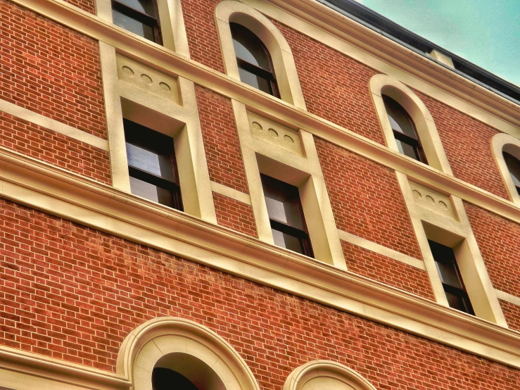 a building with circular windows that appear to be built on brick