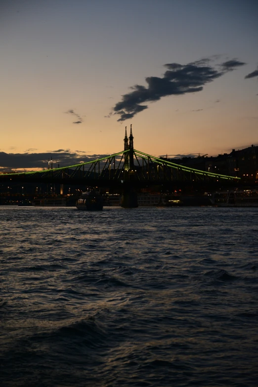 a bridge that goes across the water with a lot of lights