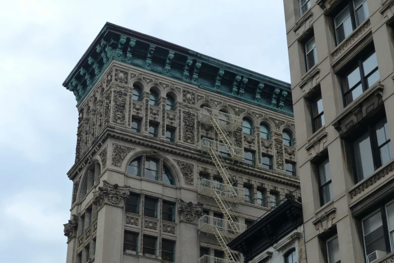 an old fashion building on the corner of this street