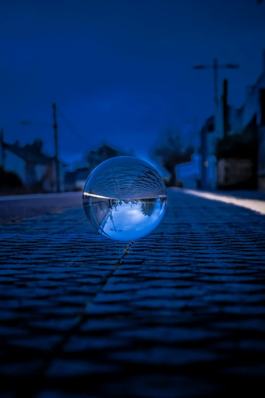 a bubble sitting in the middle of a street