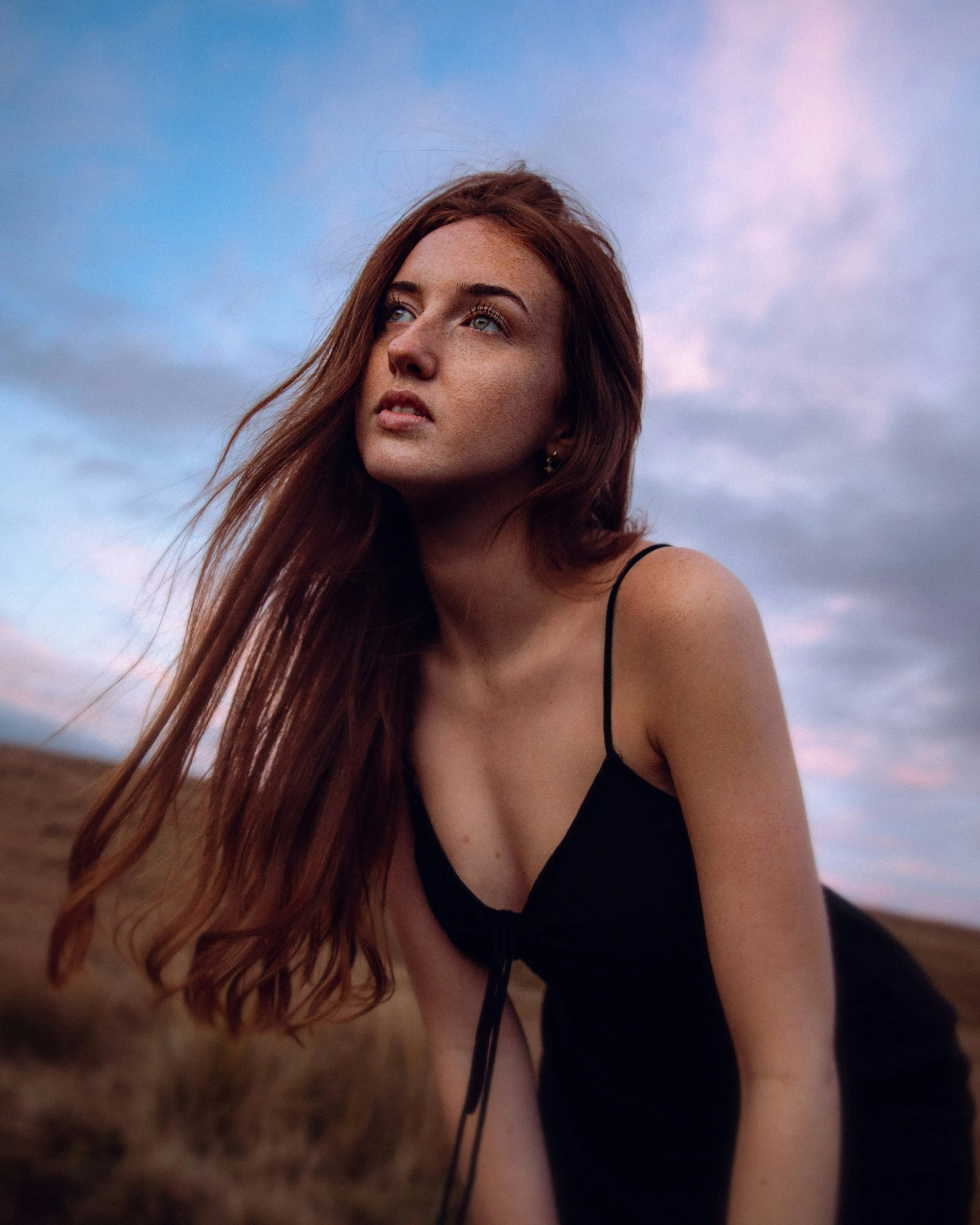 a woman with long hair in the desert