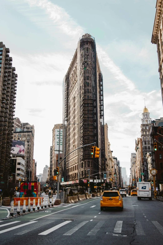 a yellow taxi is stopped at a traffic light