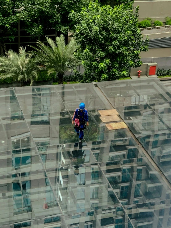 there is a glass roof with a person working