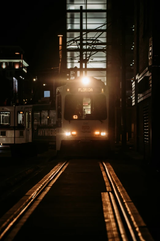 a subway train at night in a dark place