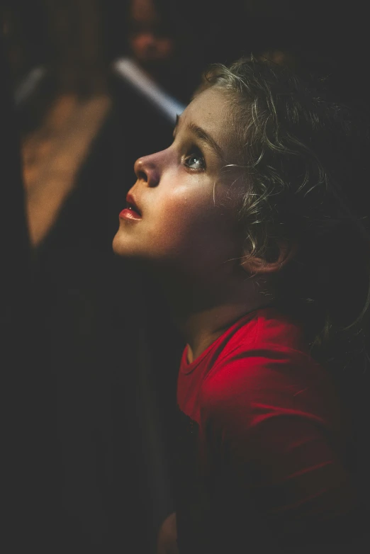 a close up of a woman's face and shoulders