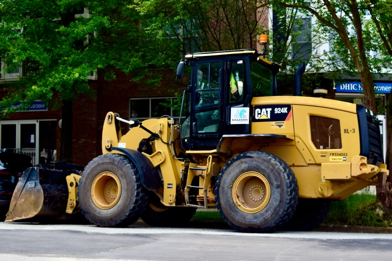 a large truck that is parked next to a sidewalk