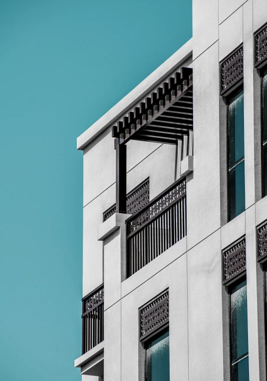 looking up at an apartment building with balcony windows and balconies