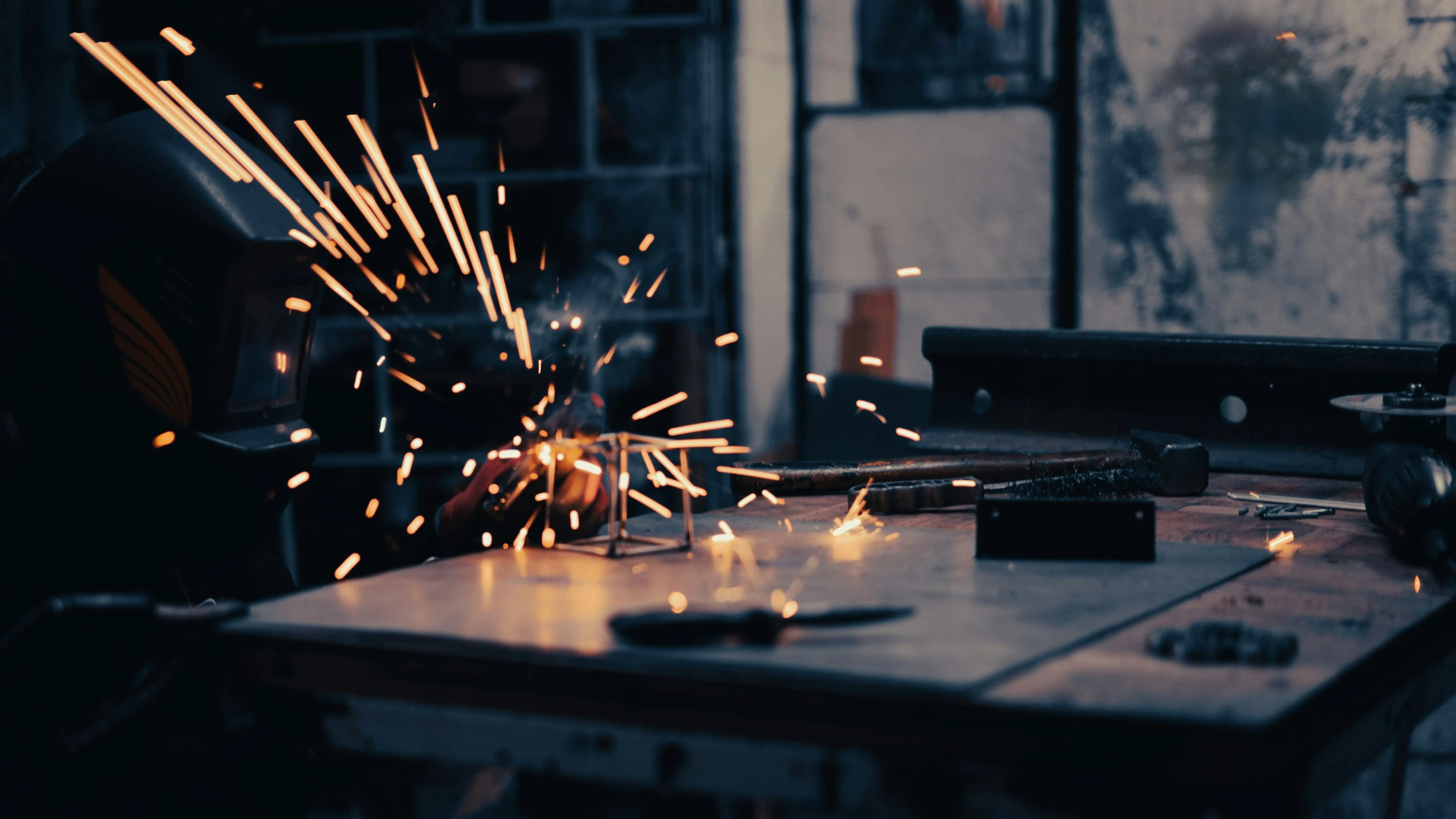 the machine is grinding metal with sparks