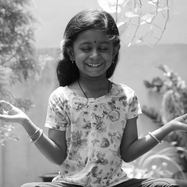 an adorable  meditating in a lotus pose