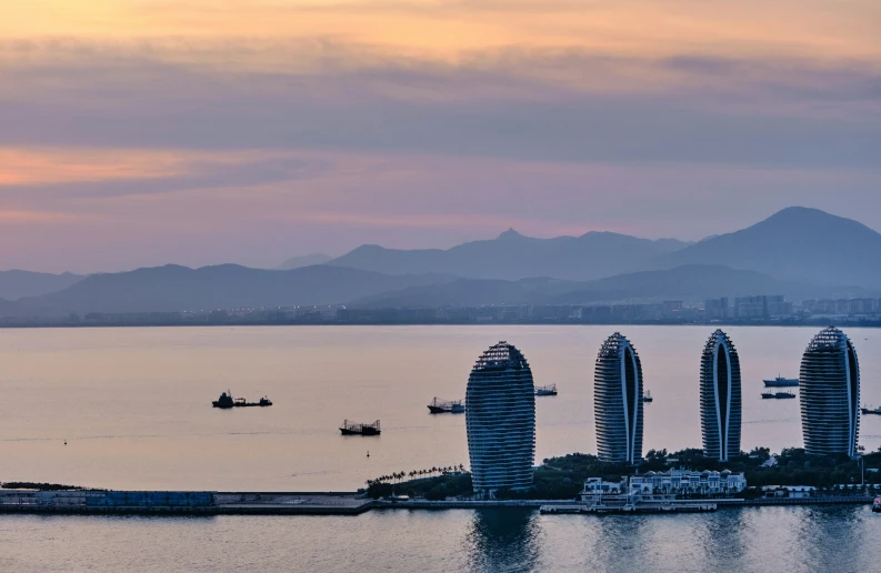 some tall buildings near a body of water