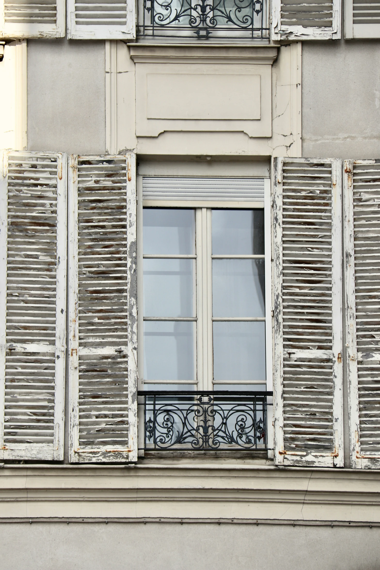 a picture of a window with shutters open