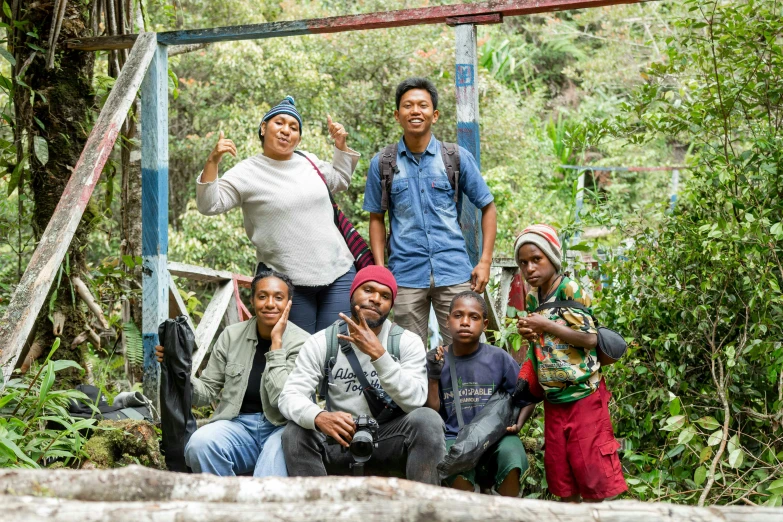 a group of people standing outside smiling and smiling