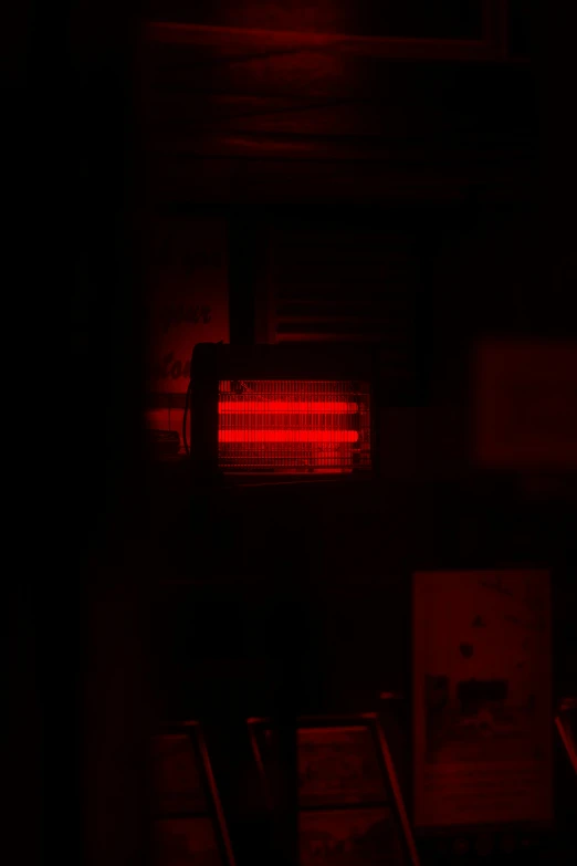 a stoplight that is in the dark